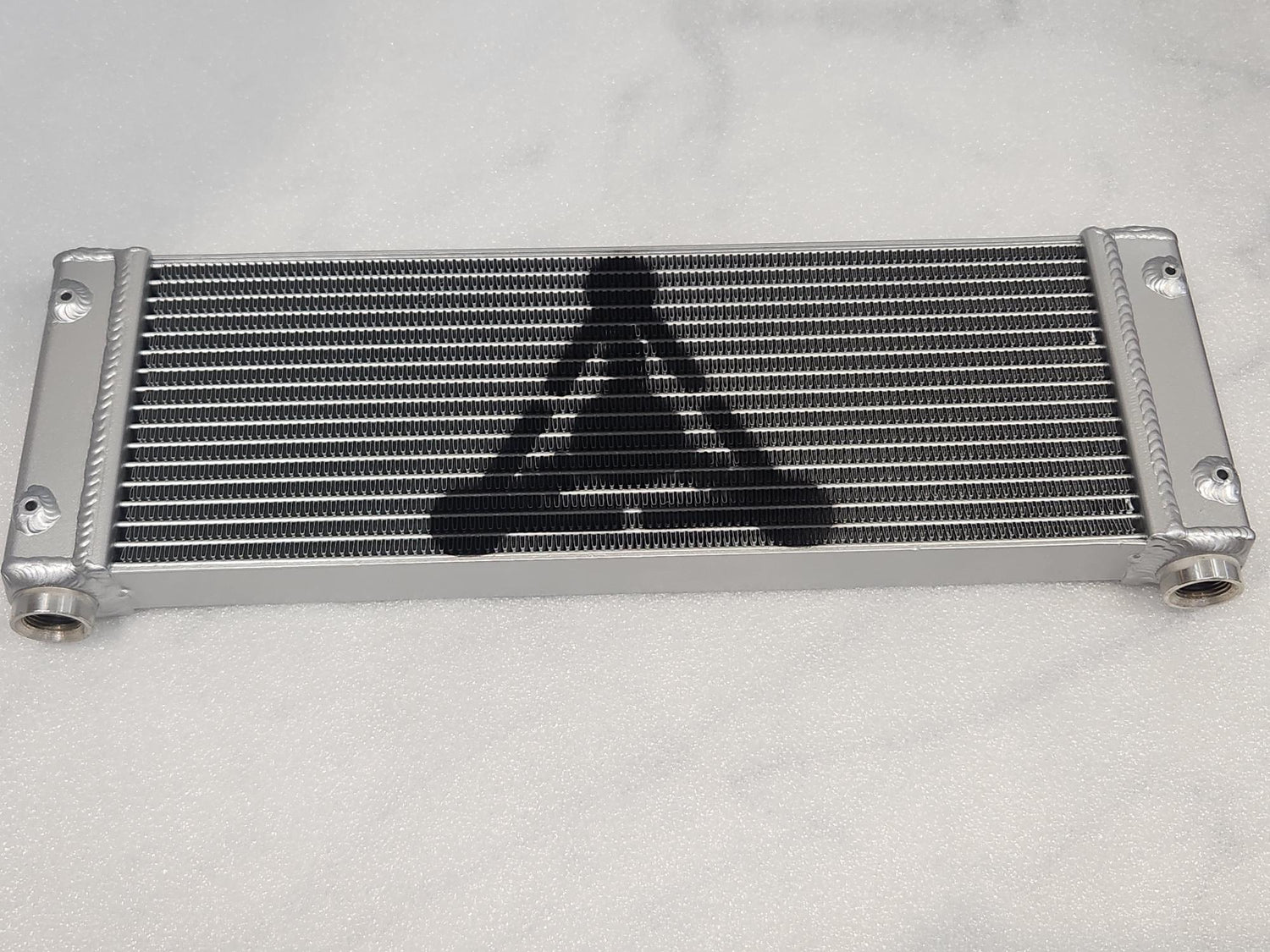 A cladded aluminum oil cooler from Delta Performance Automotive.